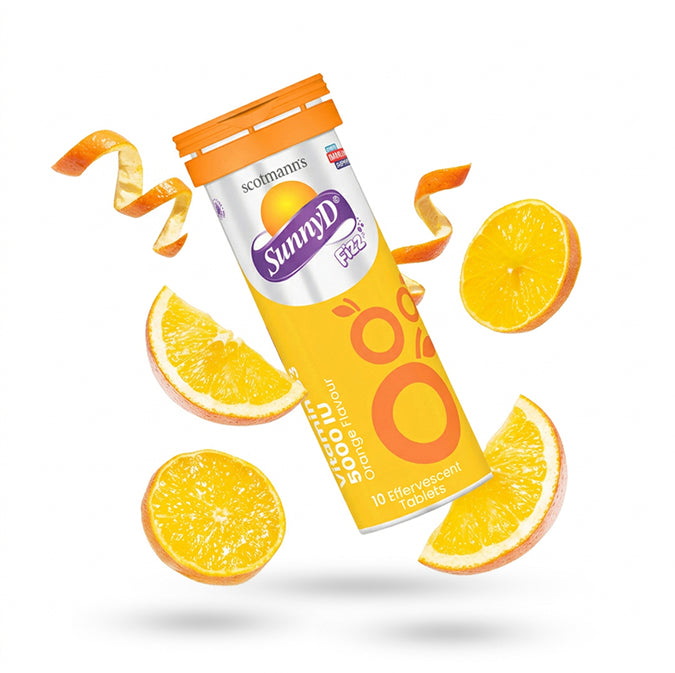 Scolemann's SunnyD vitamin supplement with orange slices on a white background